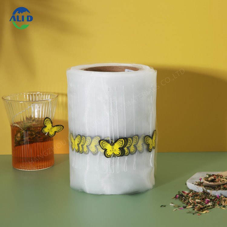 Piramīdas neilona sieta trīsstūrveida tējas maisiņu iepakojuma maisiņu plēves rullītis ar auklu un etiķeti